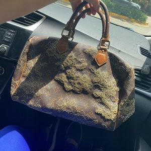 Louis Vuitton
Limited Lace Brown Coated  Satchel